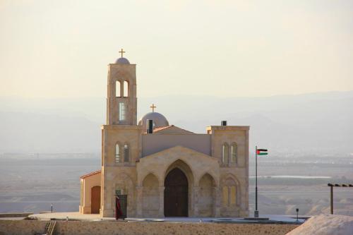a church sitting on top of a hill at Russian Pilgrim Residence in Sowayma