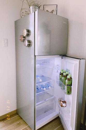 an open refrigerator with drinks inside of it at Guest House KOKORO in Yamanakako