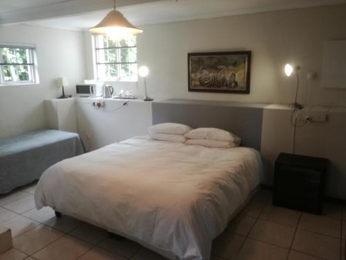 Ένα ή περισσότερα κρεβάτια σε δωμάτιο στο Valley Guest House