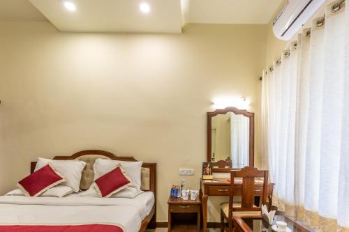 Ένα ή περισσότερα κρεβάτια σε δωμάτιο στο KSTDC Hotel Mayura Biligiri, BR Hills
