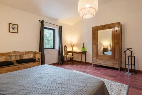 a bedroom with a bed and a large mirror at Agriturismo San Ottaviano in Monterotondo