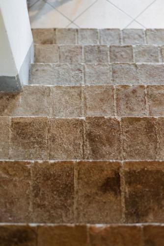 a close up of a stairway with brown bricks at Agriturismo San Ottaviano in Monterotondo