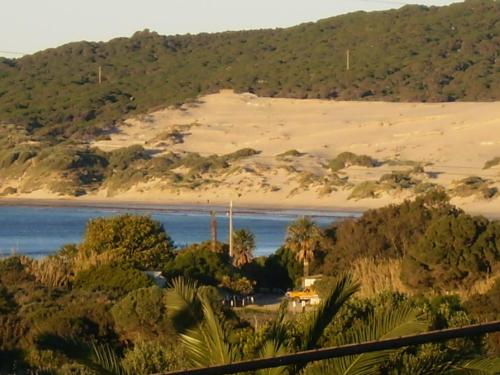 a view of a beach and a body of water at Hotel Copacabana Tarifa Beach in Tarifa