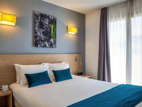Cama o camas de una habitación en Aparthotel Adagio Access Nice Magnan