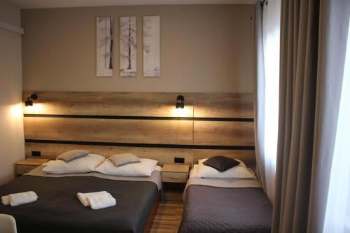 Кровать или кровати в номере Hotel 1