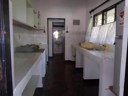 A kitchen or kitchenette at Glory Ocean Villas - Diani