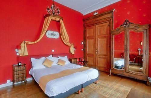 Postel nebo postele na pokoji v ubytování Chateau de Moulin le Comte