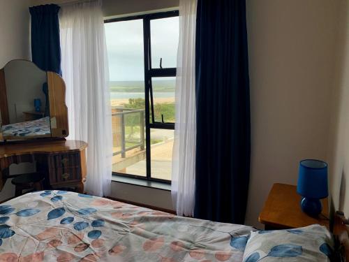 Postel nebo postele na pokoji v ubytování Bay View Witsand