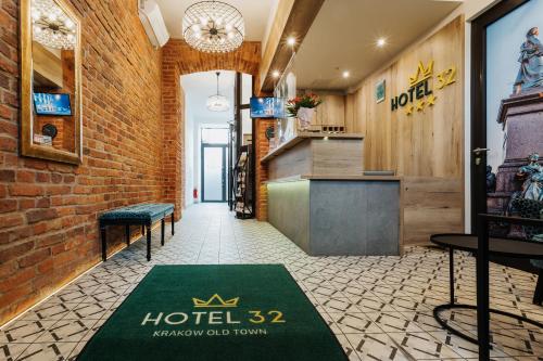 a hotel hallway with a hotel rug on the floor at Hotel 32 Kraków Old Town in Krakow