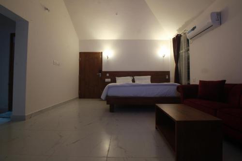 Postel nebo postele na pokoji v ubytování VIVIDEARTH Resorts Bandipur