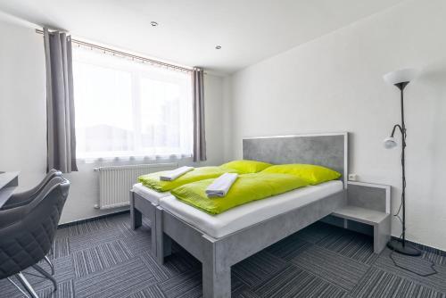 Postel nebo postele na pokoji v ubytování Garni Hotel 31