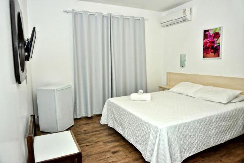 Cama o camas de una habitación en De Rose Centro Hotel