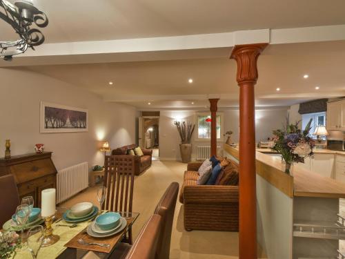 a living room with a dining table and a living room at Yew Tree Nook in Ashbourne