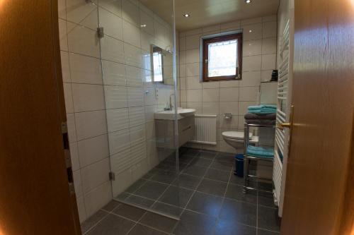 a bathroom with a toilet and a sink at Haus Glasella in Schruns-Tschagguns