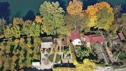 an aerial view of a house with trees and water at Kucerak na Drini in Bajina Bašta