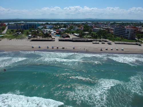 an aerial view of a beach and the ocean at Don Luis Hostal - Sucursal Galeana - Tecolutla in Tecolutla
