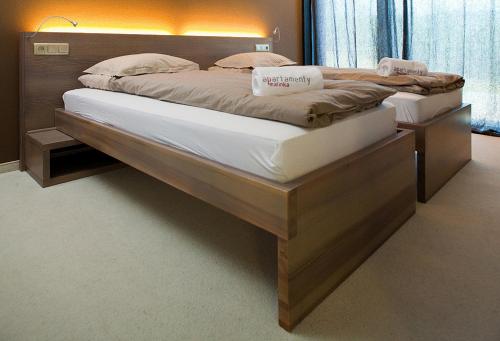 Postel nebo postele na pokoji v ubytování Apartamenty Malinka