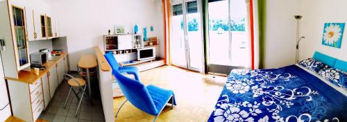a room with a bedroom with a bed and a desk at Apartment Lent in Maribor