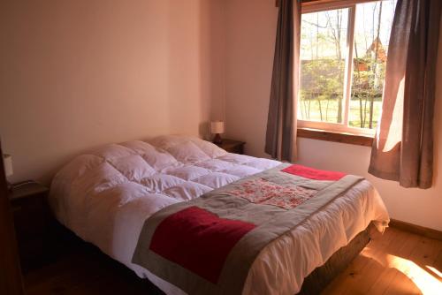 מיטה או מיטות בחדר ב-Ecos de Lefun