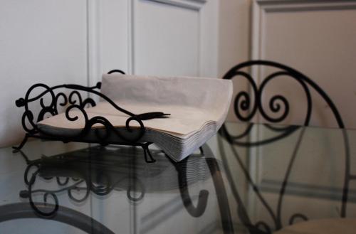 a glass table with a chair on top of it at B&B Avenue Deschanel in Brussels