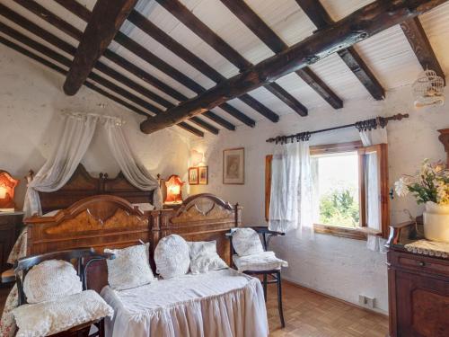 a bedroom with two beds and a window at Spacious Cottage in Veneto in Crespano del Grappa