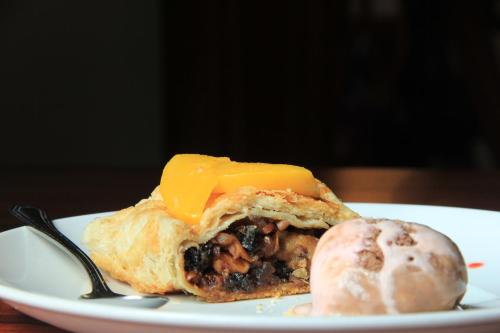 a piece of food on a plate with a biscuit at La Casa del Marqués in Comitán de Domínguez