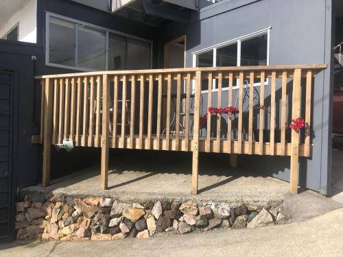 a wooden staircase in front of a house at Taurikura Bay Relax and Explore in Whangarei Heads
