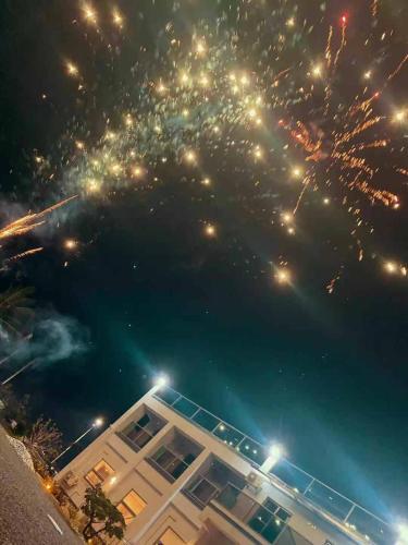a view of fireworks in the sky over a building at 枋山六號 in Fangshan