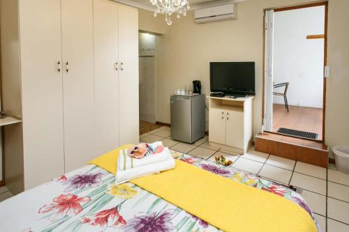 En eller flere senge i et værelse på Langenhoven B&B