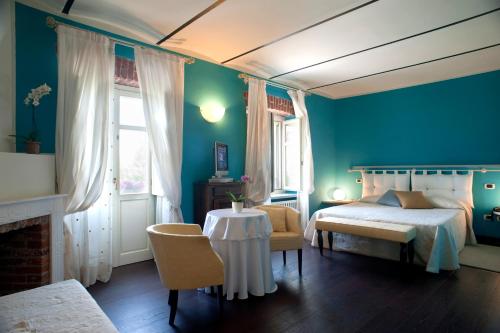 Posteľ alebo postele v izbe v ubytovaní Hotel Cascina Di Corte