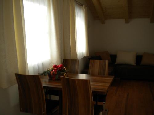 a living room with a table and chairs and a couch at Haus Helene in Rauris