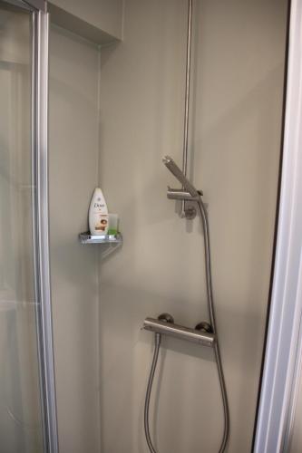 a shower in a bathroom with a shower at Penthouse Sun Corner Knokke in Knokke-Heist