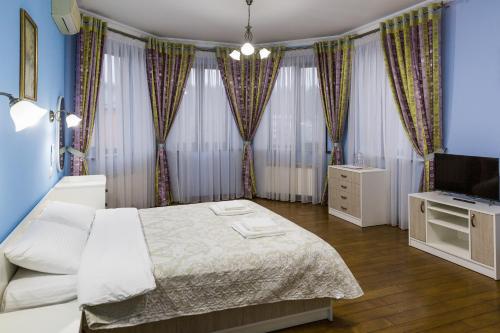 Llit o llits en una habitació de Villa Miliy Dom