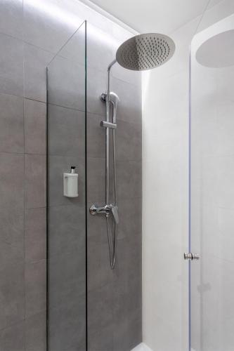 a shower with a glass door in a bathroom at B&B HOTEL Madrid Alcorcón in Alcorcón