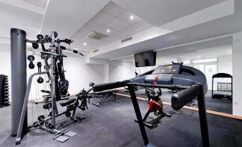 a room with a gym with treadmills and a treadmill at Hotel Perla in Dubrovnik