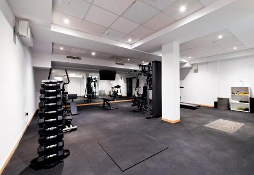 a room with a gym with tread machines at Hotel Perla in Dubrovnik