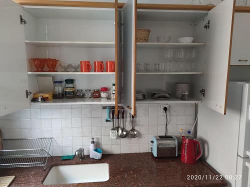 Η κουζίνα ή μικρή κουζίνα στο Apartments COMFY - for a quiet family holiday
