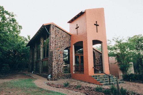 a church with crosses on the side of it at ATKV Klein-Kariba in Bela-Bela