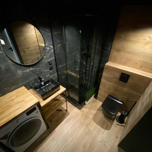 an overhead view of a bathroom with a sink and a mirror at Countryside Retreat in Janowice Wielkie