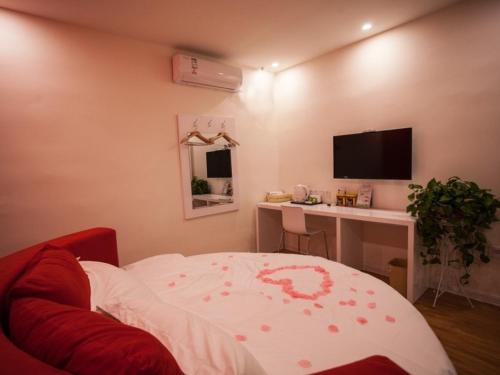 Televisyen dan/atau pusat hiburan di Shell Zaozhuang Taierzhuang Ancient City Battle Memorial Hotel
