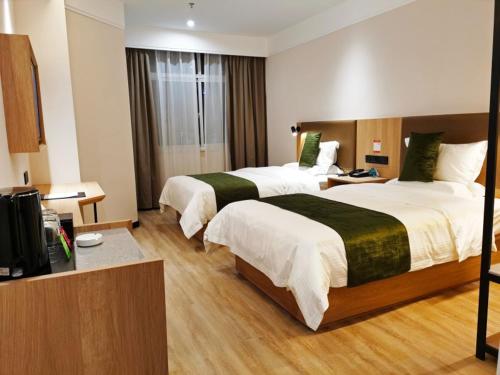Katil atau katil-katil dalam bilik di GreenTree Inn Ankang Bashan Middle Road