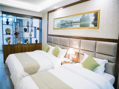 Llit o llits en una habitació de GreenTree Inn Chaohu West Health Road Aixin Hospital Business Hotel