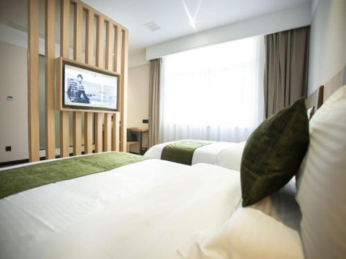 Katil atau katil-katil dalam bilik di GreenTree Inn Ankang Bashan Middle Road