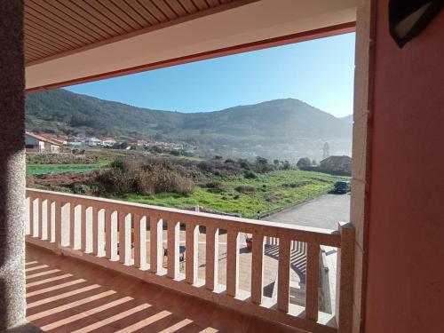 a view from the balcony of a house at Hotel A Raiña in Oia