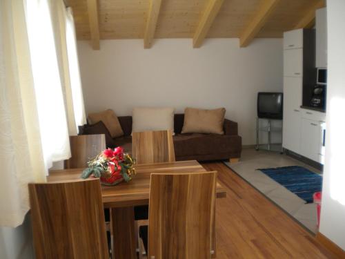 a living room with a table and a couch at Haus Helene in Rauris