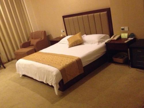 Ένα ή περισσότερα κρεβάτια σε δωμάτιο στο GreenTree Inn JiangSu YanCheng Bus Station Business Hotel