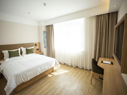 Katil atau katil-katil dalam bilik di GreenTree Inn Ankang Bashan Middle Road