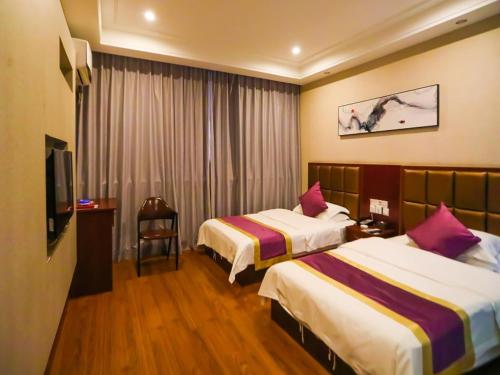 Postel nebo postele na pokoji v ubytování Shell Jincheng Gaoping City East Changping Road Hotel
