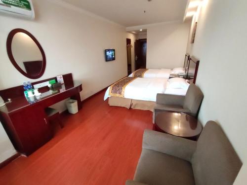 Ένα ή περισσότερα κρεβάτια σε δωμάτιο στο GreenTree Inn Hefei Railway Station Baima Phase III Baowen Business Building Express Hotel