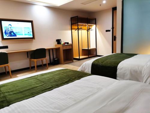 Katil atau katil-katil dalam bilik di GreenTree Inn Ankang Bashan Middle Road